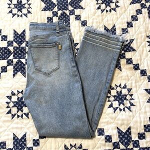 Vibrant distressed jeans with a raw hem